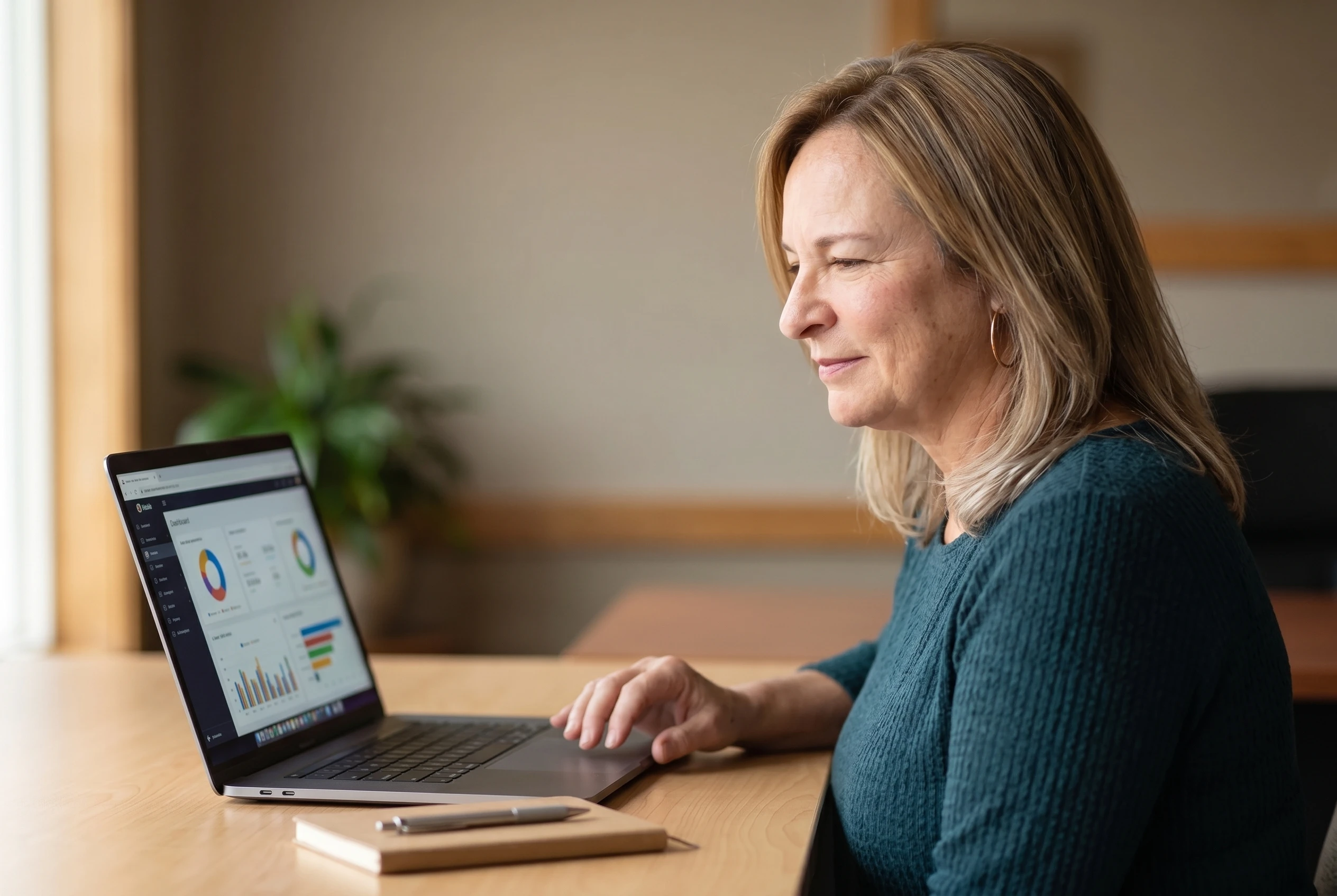 Shannan Hamilton at her desk reviewing dashboards